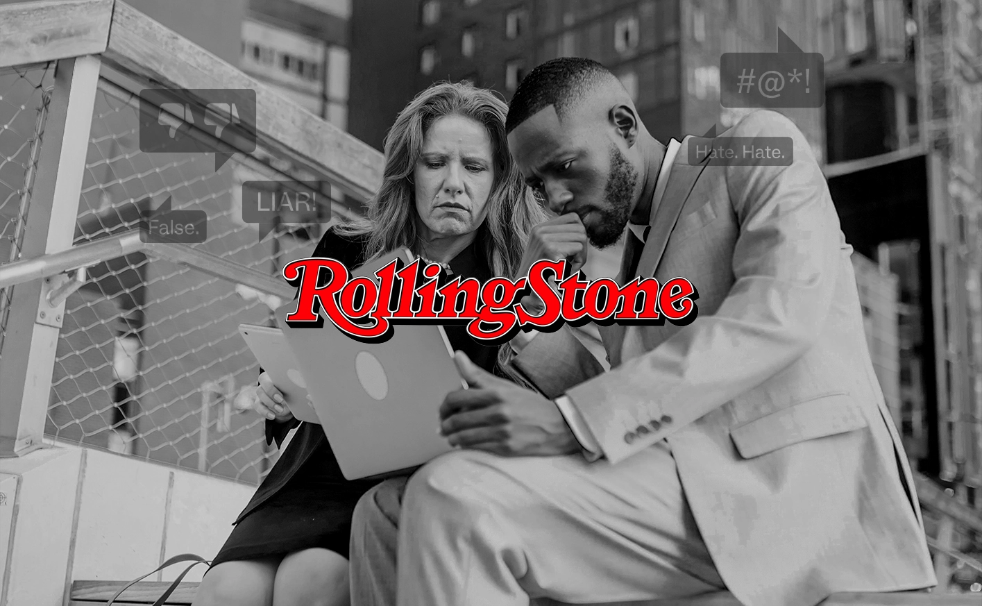 alt="Two people look at a laptop with hate speech comments surrounding them. The Rolling Stone logo is on top of this image."