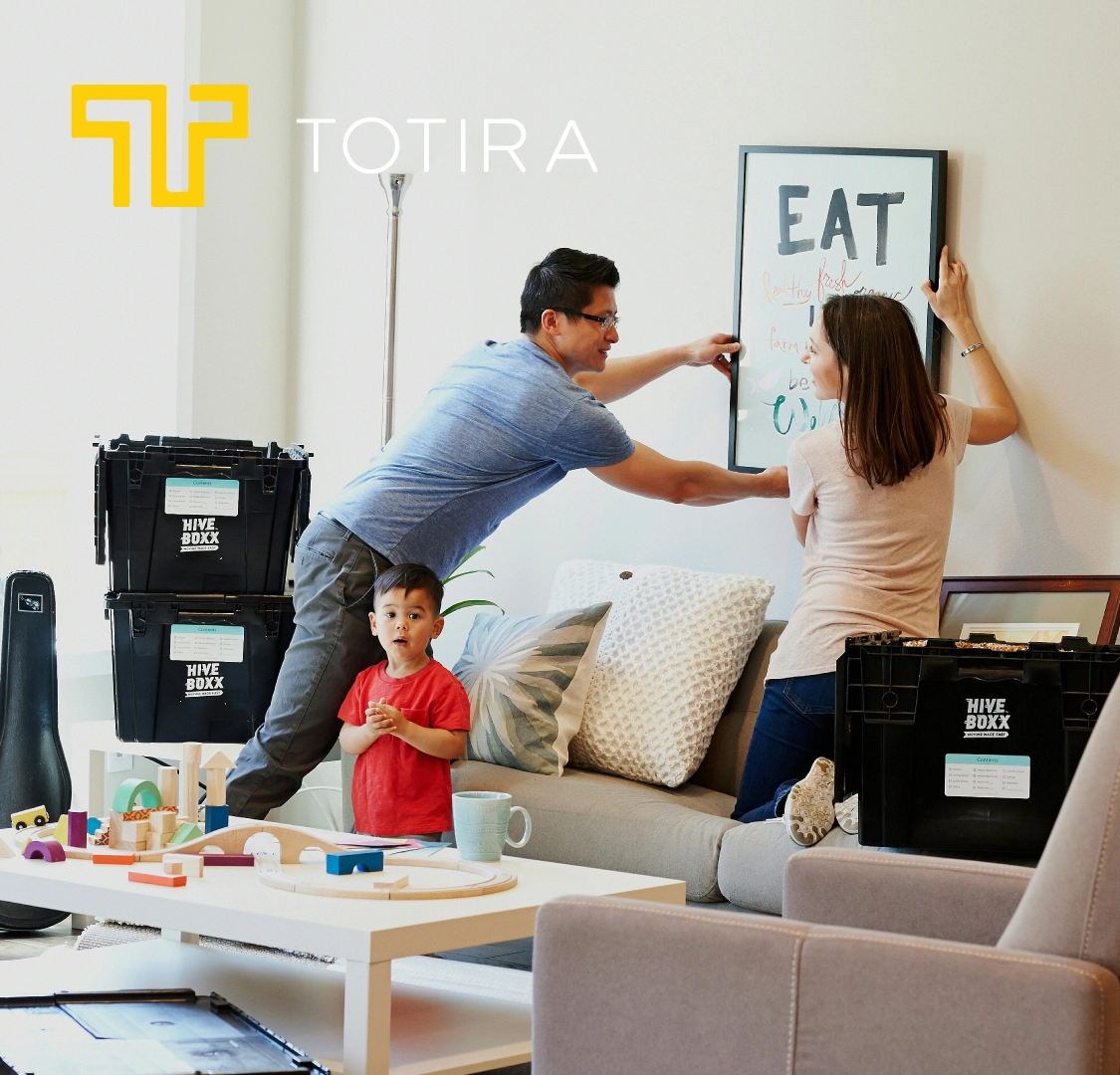 Family decorating home with Totira icon overlayed